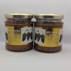 Two jars of 'MR NAGA Gold' hot sauce on a white background