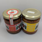 Two jars of food with labels on a white background