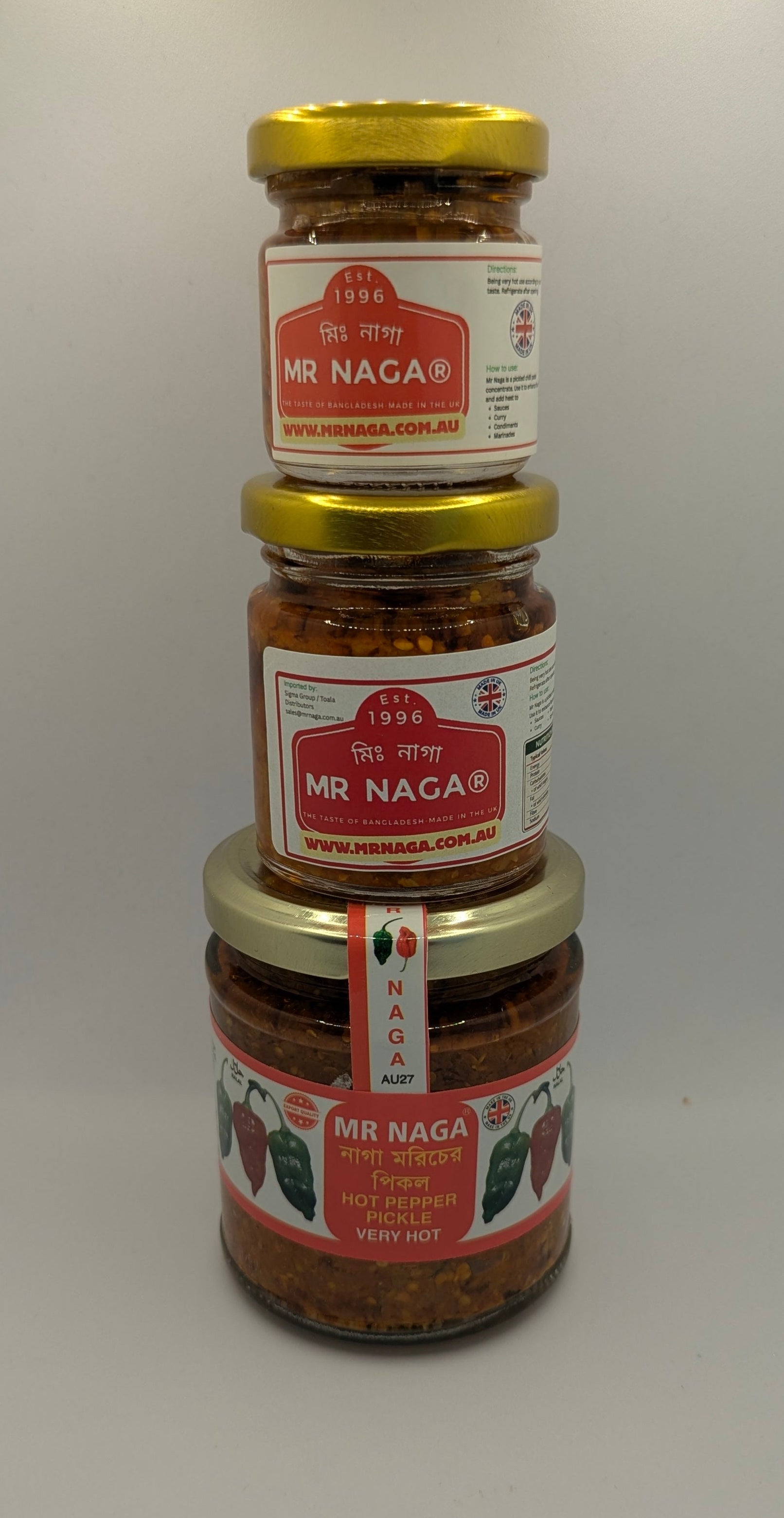 Three jars of Mr. Naga food products stacked on a white background