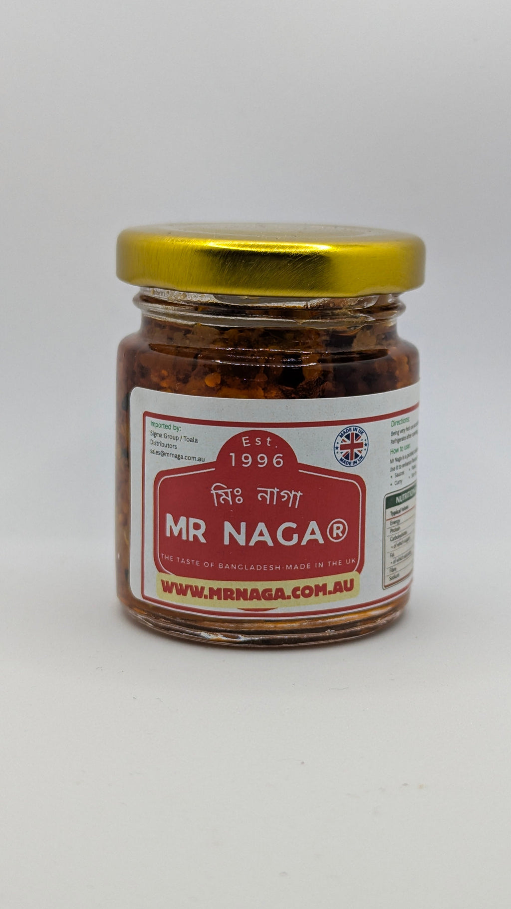 Jar of Mr Naga spice with a gold lid on a white background