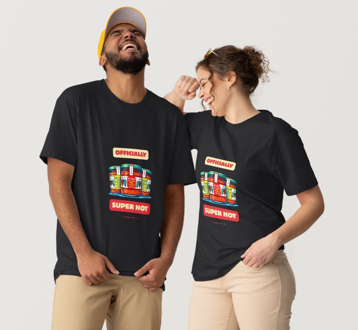 Two people wearing black t-shirts with colorful text and graphics on a plain background